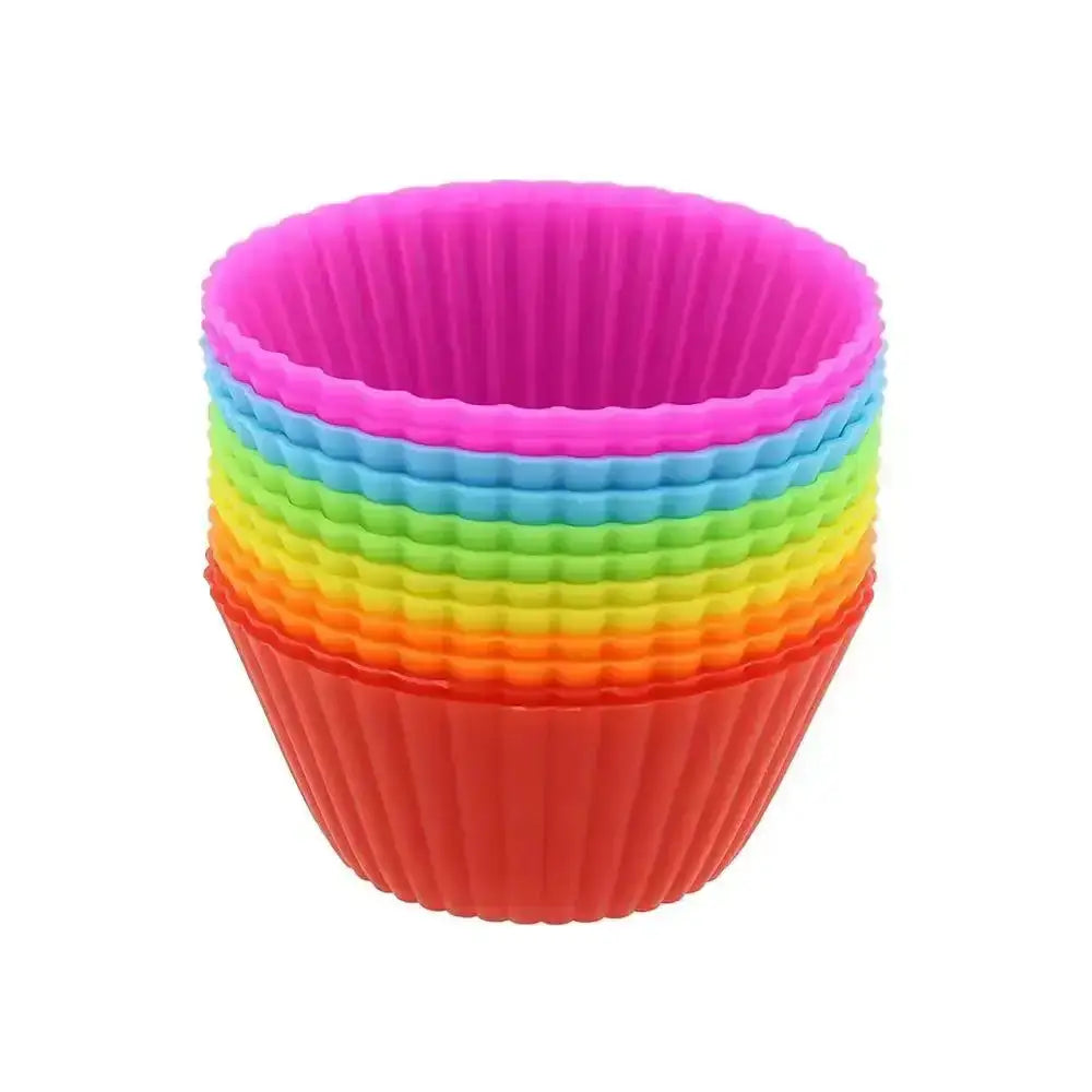 Set of colorful silicone cupcake liners on a white background