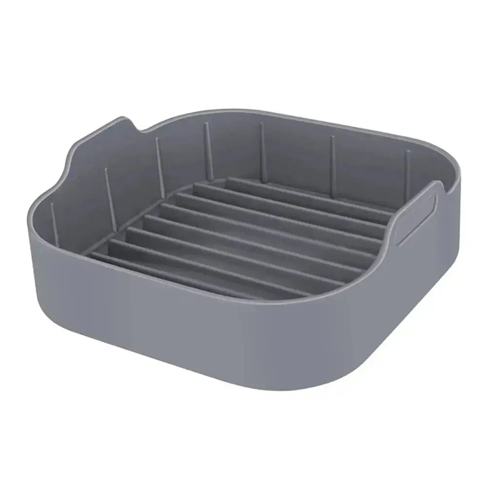 Gray silicone dish with slotted design on a white background
