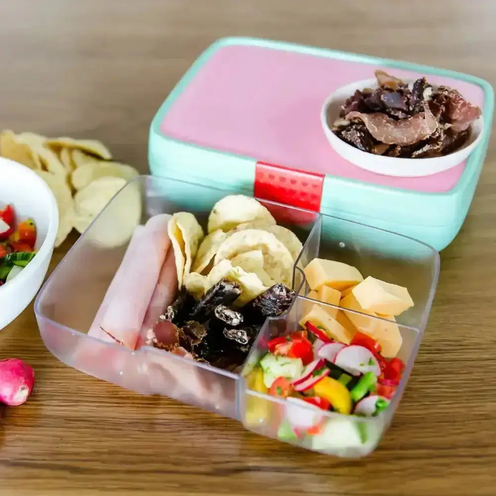 Crunchbox Classic 3-compartment lunchbox with cheese, ham, chips, and salad on wooden table