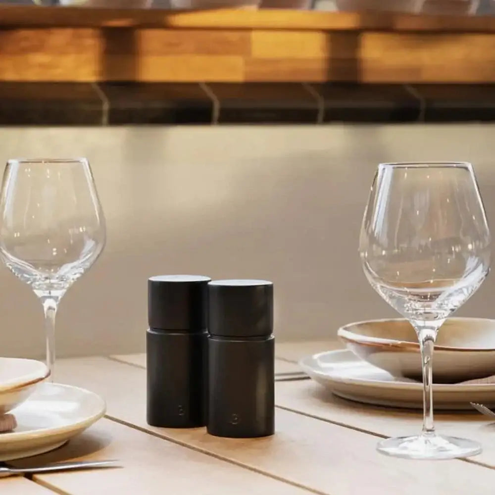 CrushGrind Bergen beechwood salt and pepper grinder set on a dining table with glassware, Cookin Stores kitchenware