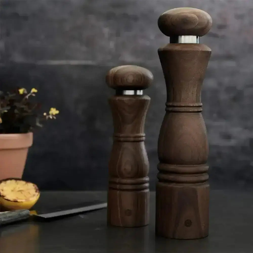 CrushGrind Paris walnut salt or pepper grinders on kitchen counter, premium kitchenware at Cookin Stores