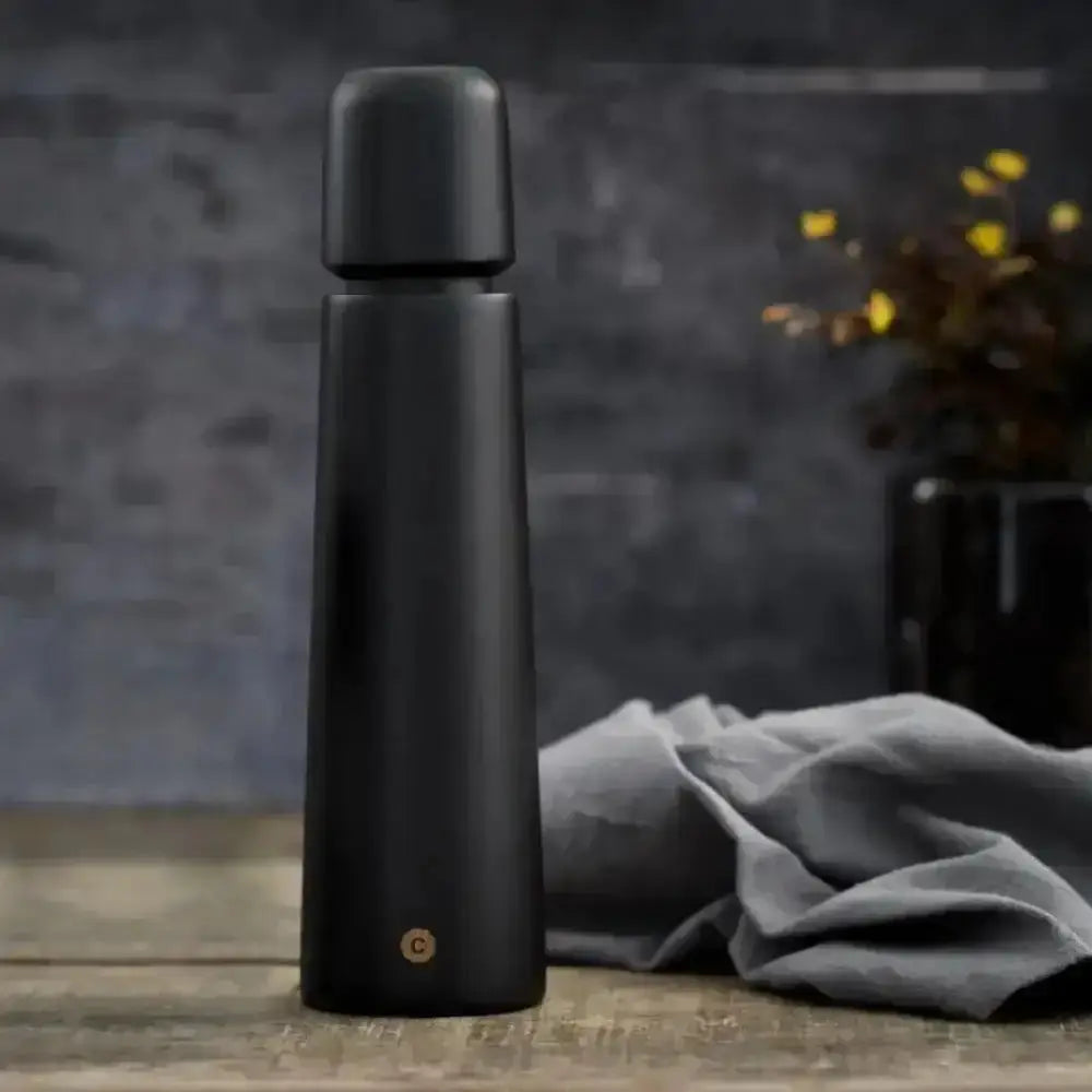 Black wood CrushGrind salt or pepper grinder on rustic table, Cookin Stores kitchenware
