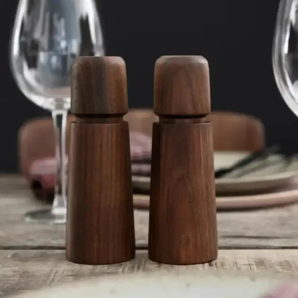 CrushGrind Stockholm walnut salt or pepper grinders on rustic table, Cookin Stores kitchenware