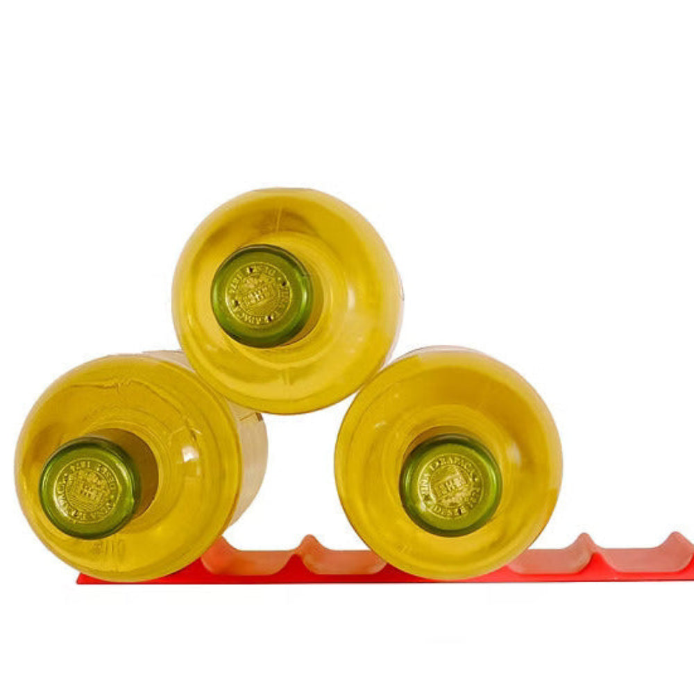 Three yellow bottles with green labels on a red stand against a white background