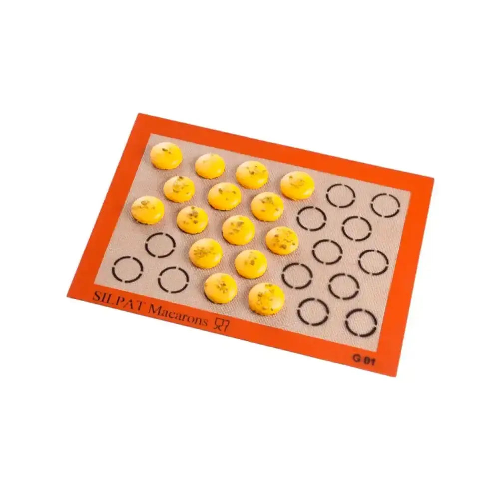 Silicone mat with macaron shells and circles on a white background