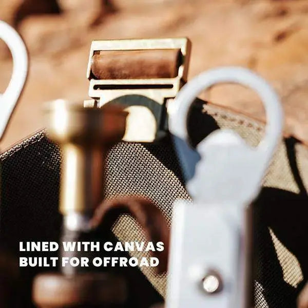 Close-up of rugged leather and canvas jack sack with metal buckle, offroad gear shown, Cookin Stores