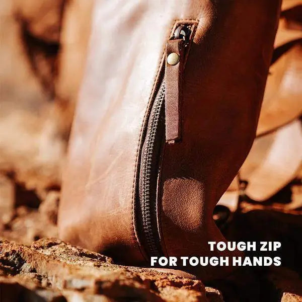 Close-up of brown leather zip pouch on rocks, premium kitchenware accessory from Cookin Stores