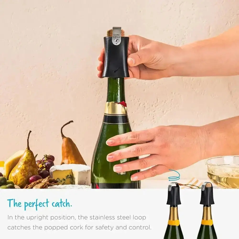 Dreamfarm Champop champagne bottle opener in use on a bottle, with cheese and fruit nearby, Cookin Stores kitchenware