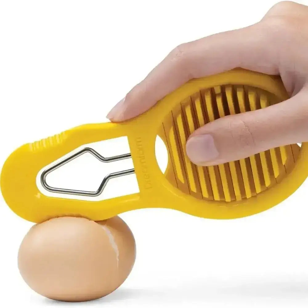 Yellow egg separator with a hand holding it and an egg on a white background