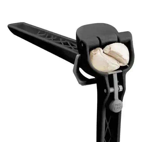 Black Dreamfarm Garject Lite garlic press with unpeeled garlic cloves, Cookin Stores kitchenware
