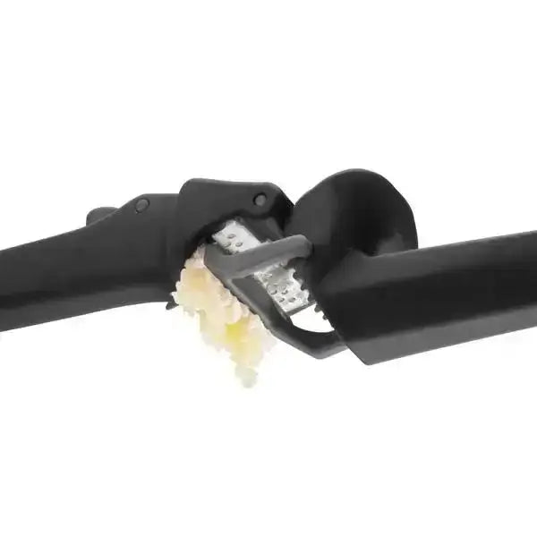 Black Dreamfarm Garject Lite garlic press in use with fresh garlic, premium kitchenware Cookin Stores