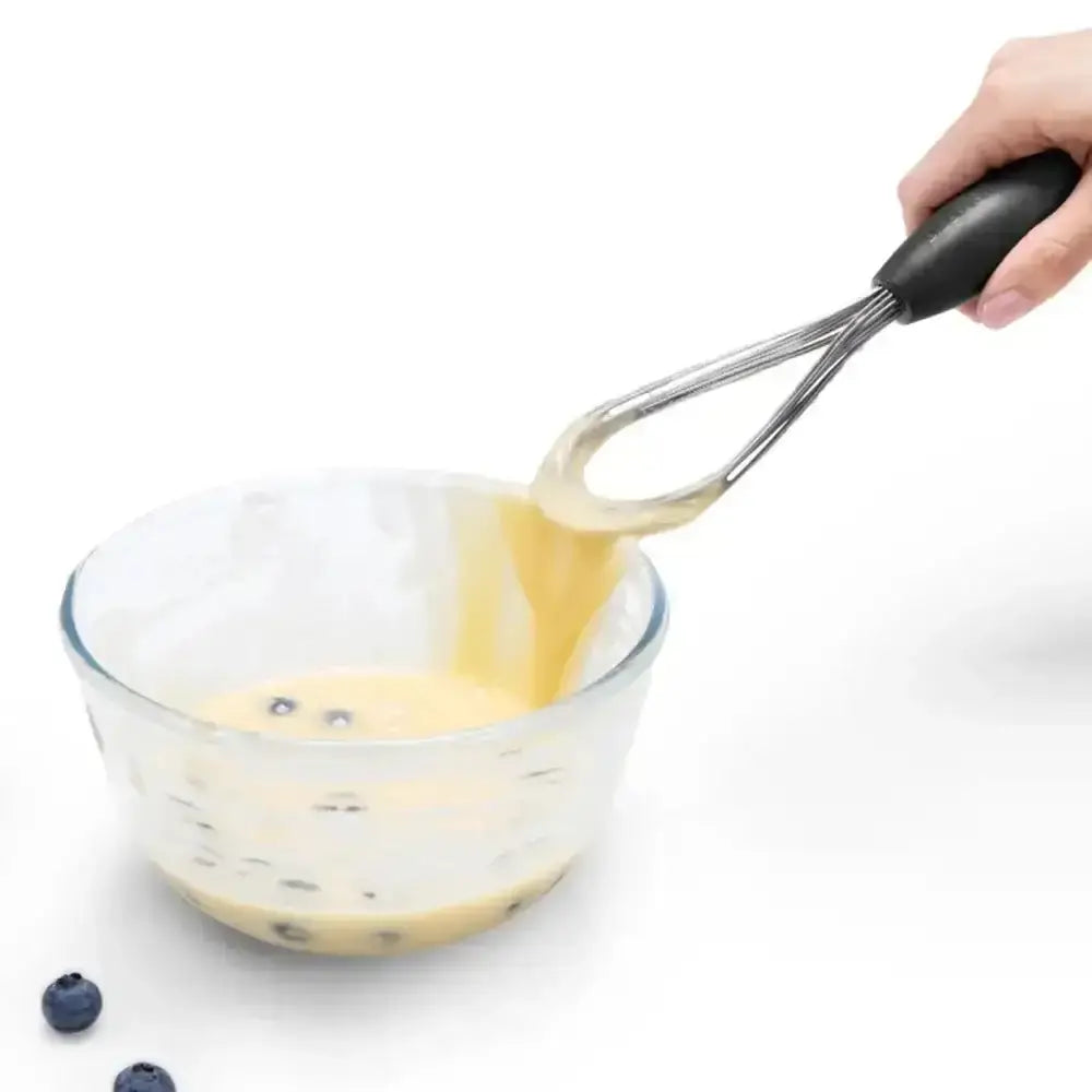 DreamFarm Mini Flisk whisk mixing batter with blueberries in glass bowl, Cookin Stores kitchenware