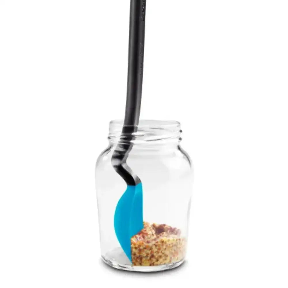 Glass jar with a black and blue spoon inside on a white background