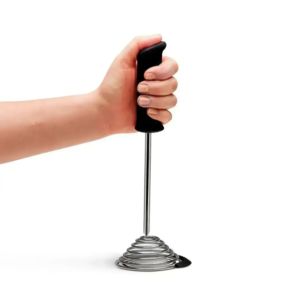 Hand holding Dreamfarm Smood Masher charcoal black from Cookin Stores on white background
