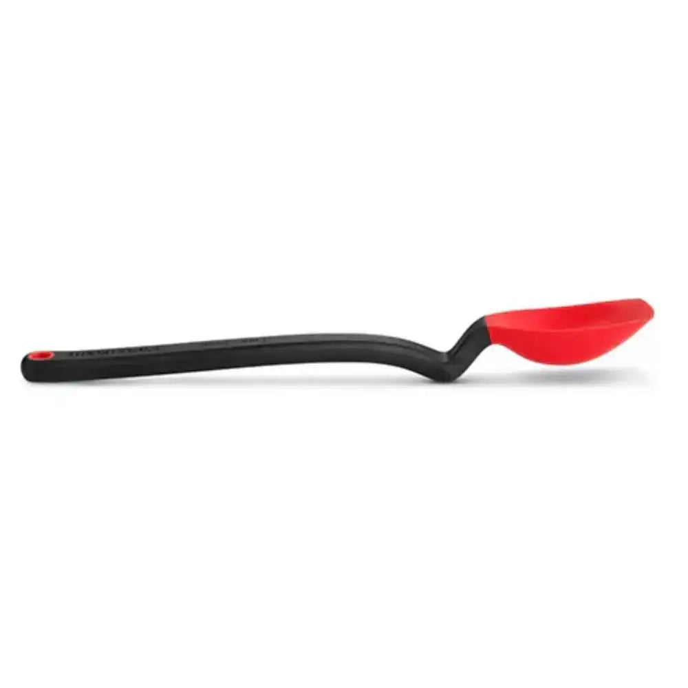 Black spoon with a red silicone head on a white background