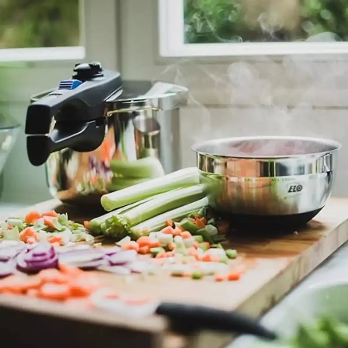 Pressure cooker set on a table with preared vegetables