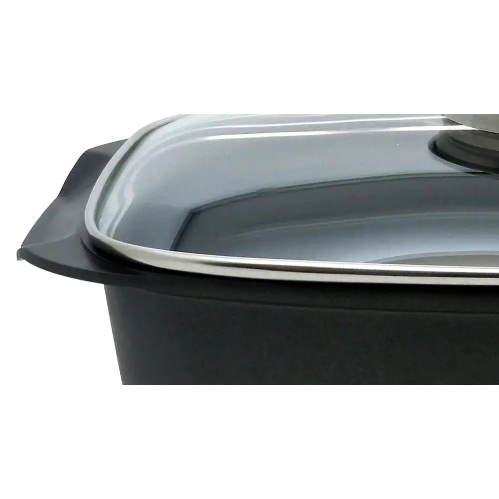 Black rectangular baking dish with a clear glass lid on a white background