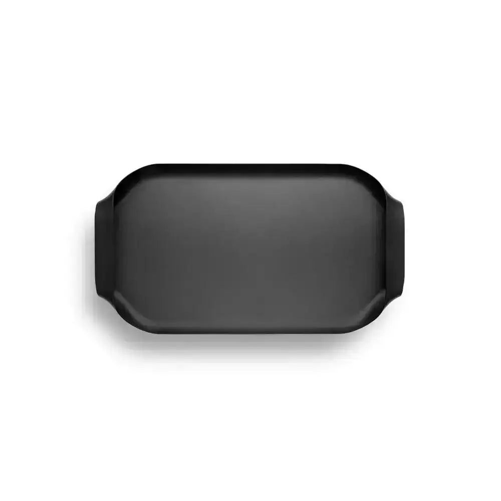 Black Eva Solo stainless steel serving tray with side handles on white background