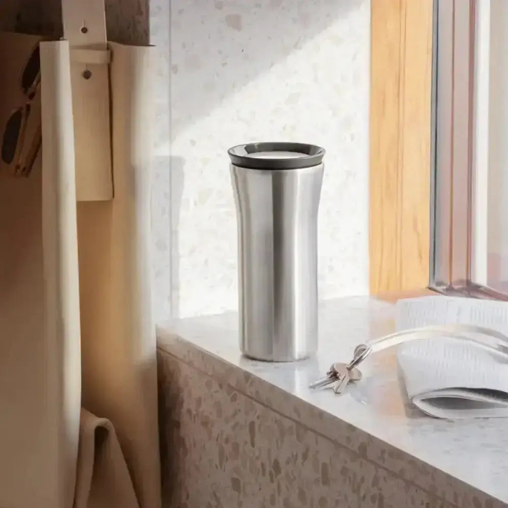 Stainless steel Eva Solo City To Go Cup on terrazzo windowsill, modern kitchenware at Cookin Stores