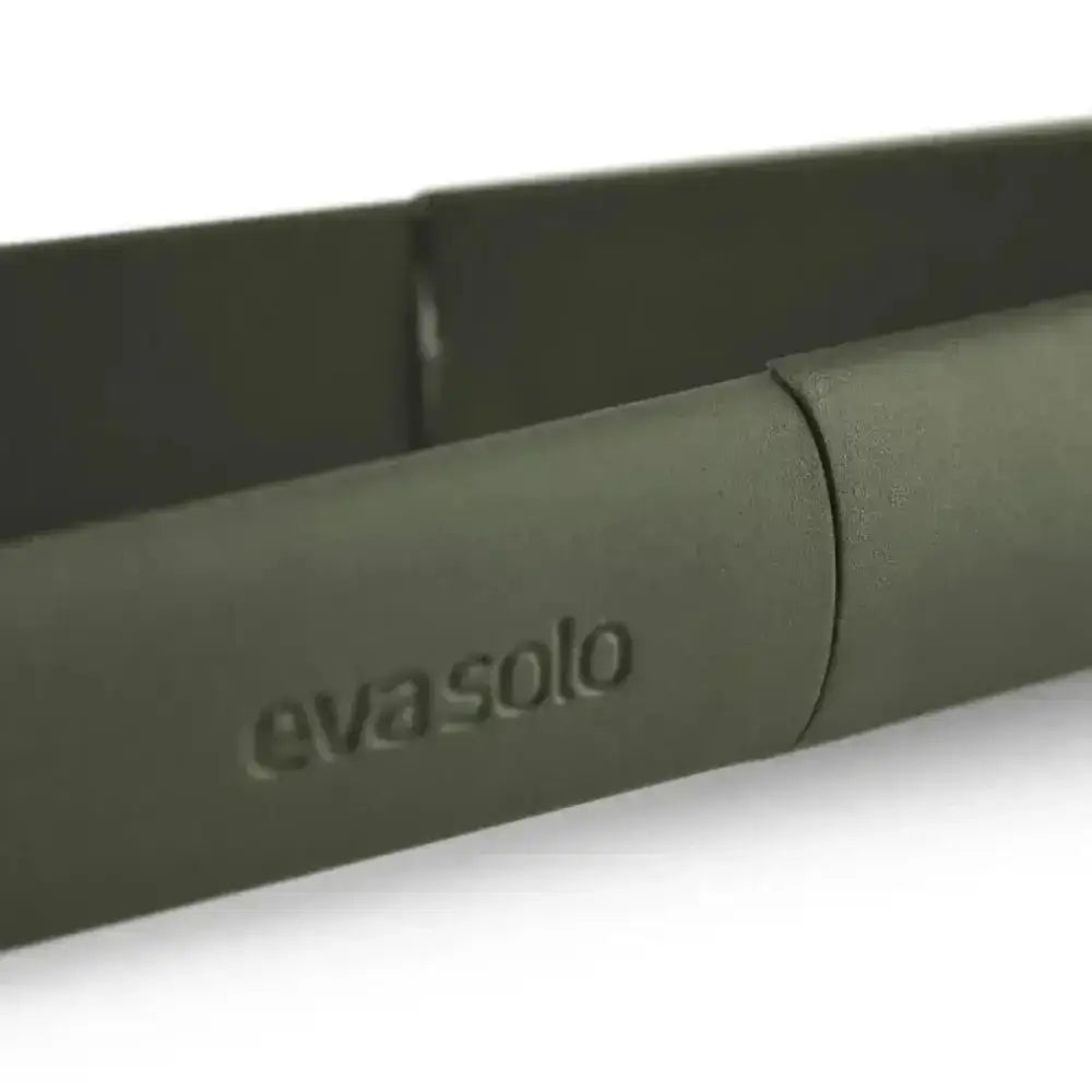 Close-up of green Eva Solo food tweezer kitchen tool, available at Cookin Stores