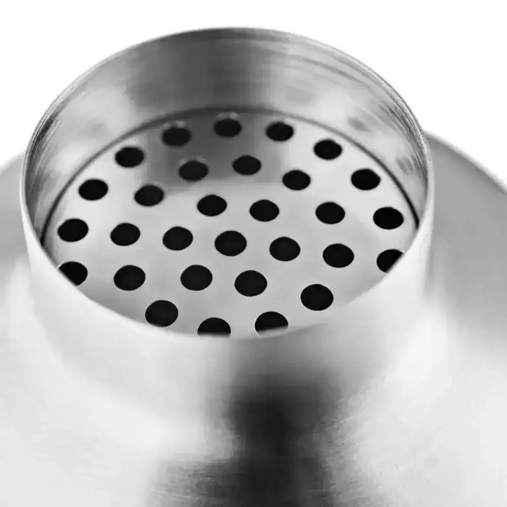 Metallic shaker lid with a perforated design on a white background