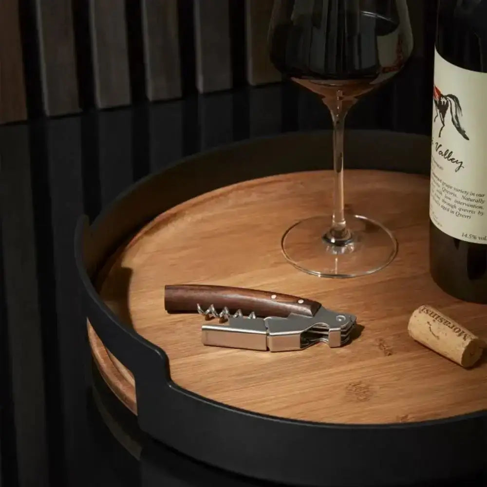 Wine bottle, glass, corkscrew, and cork on wooden tray from Cookin Stores kitchenware