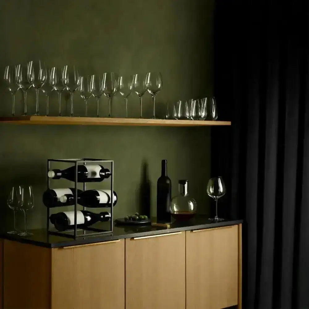 Nordic metal wine rack with bottles on modern kitchen cabinet, glassware on shelf, Cookin Stores