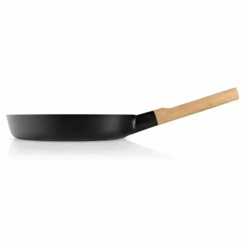 Black frying pan with a wooden handle on a white background