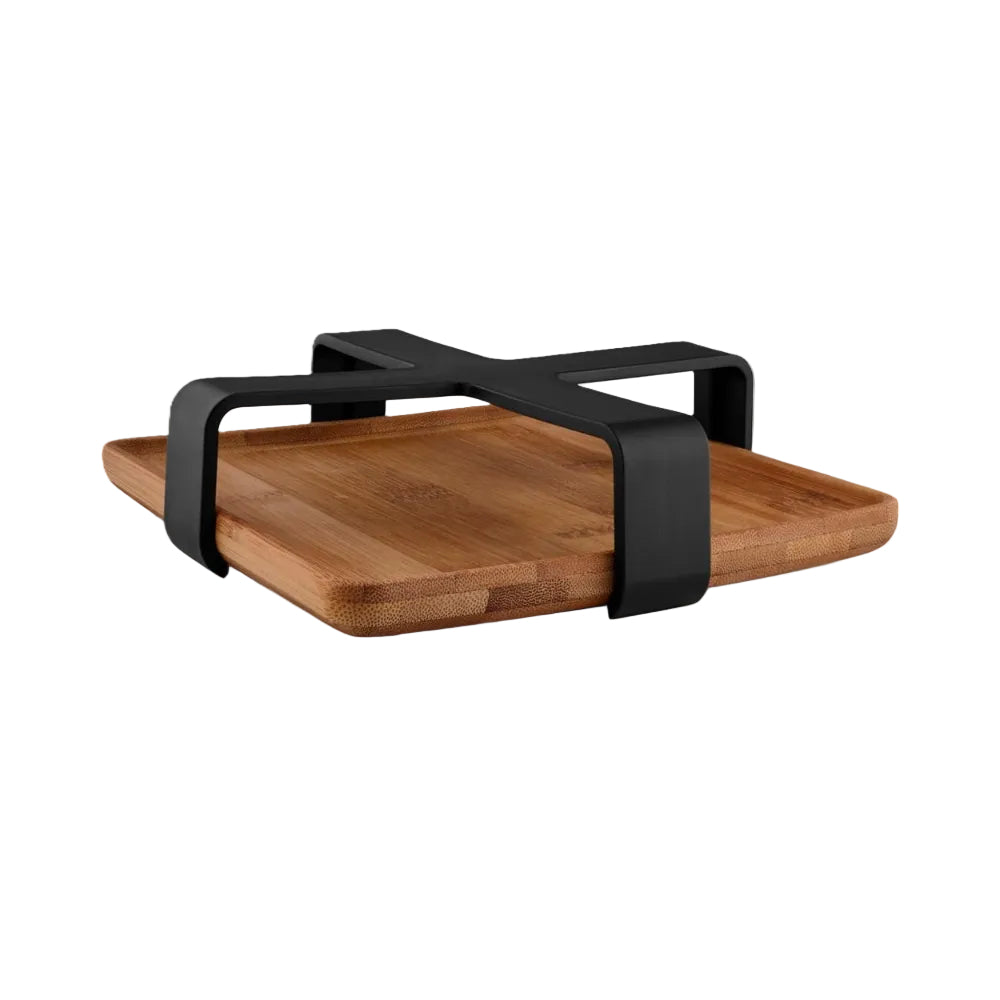 Wooden cutting board with black metal handle on a white background