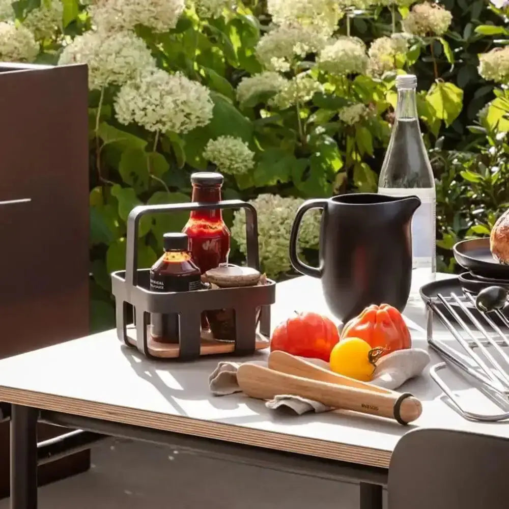 Eva Solo Nordic table caddy with condiments on outdoor dining table, premium kitchenware
