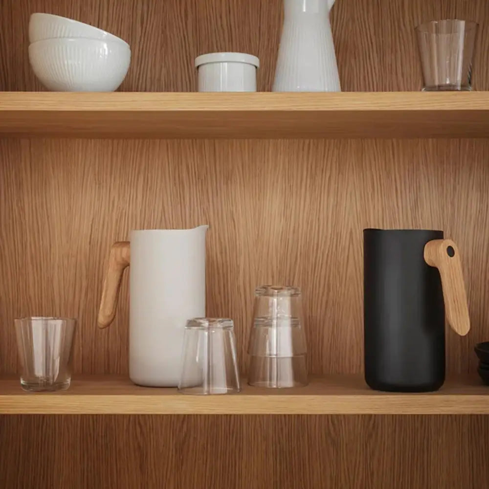 Wooden shelves with kitchenware including bowls, cups, and jugs.