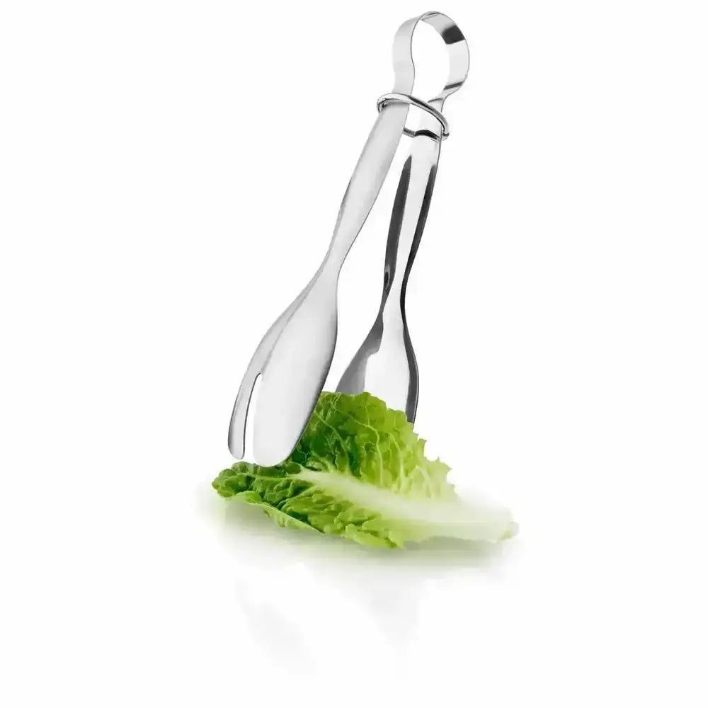 Metallic salad tongs holding a piece of lettuce on a white background