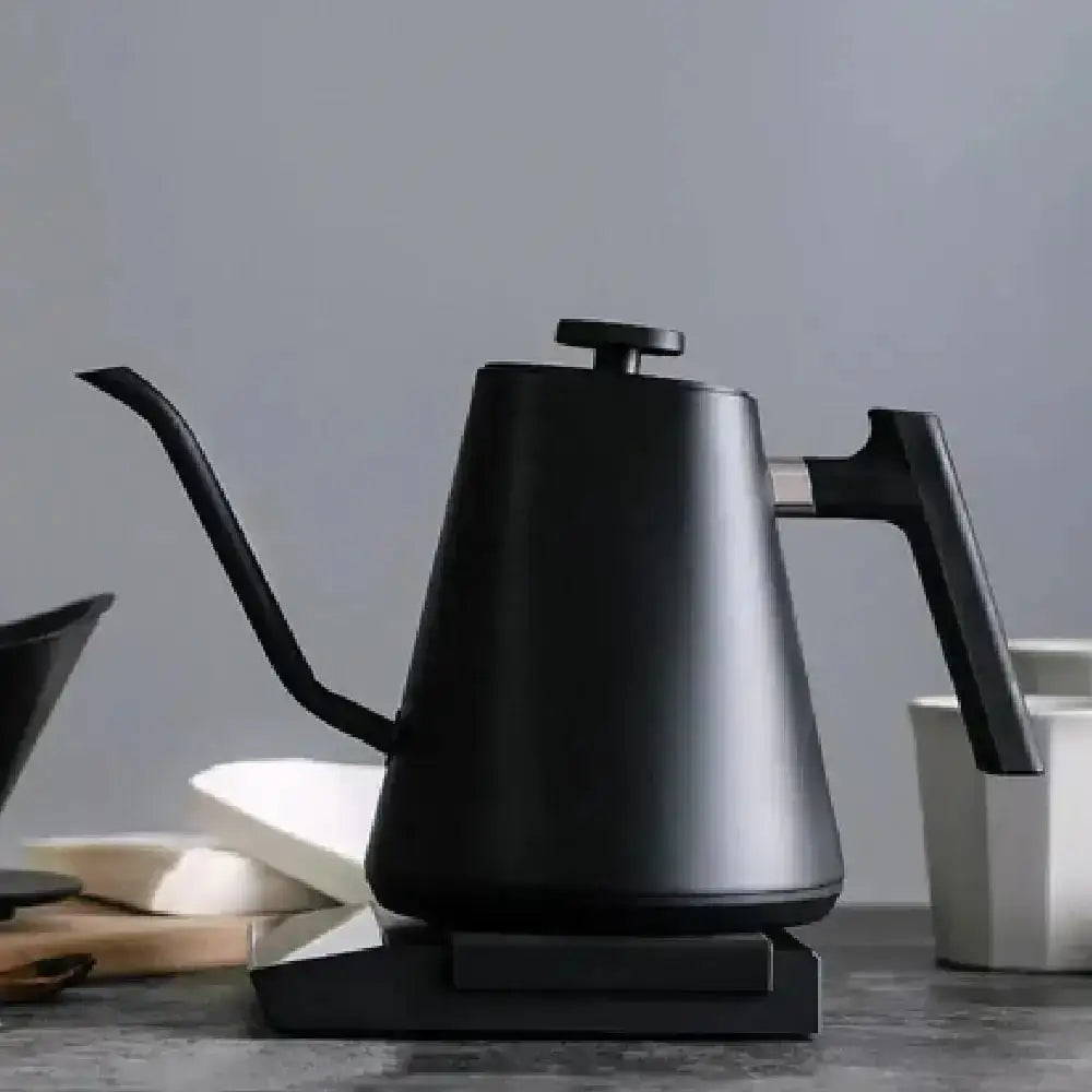 Modern black electric pour over kettle on a kitchen counter, premium kitchenware at Cookin Stores