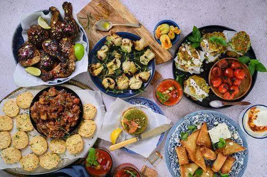 Assorted gourmet appetizers and kitchenware on a tabletop, Cookin Stores premium homeware.