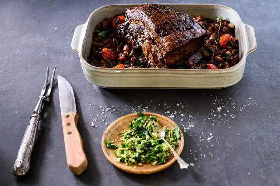 Roast beef in ceramic baking dish with herbs and vegetables, premium kitchenware Cookin Stores