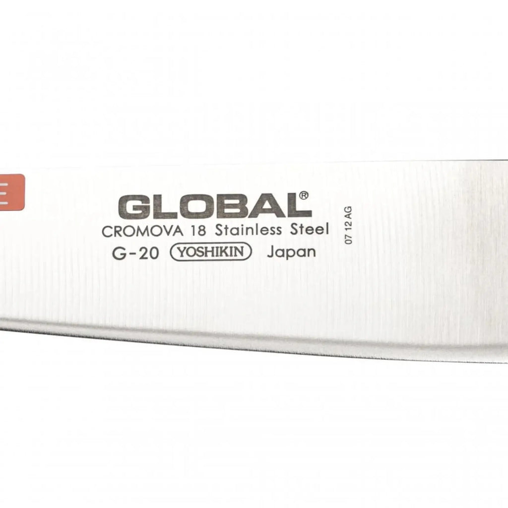 Close-up of a Global knife blade with branding and specifications.