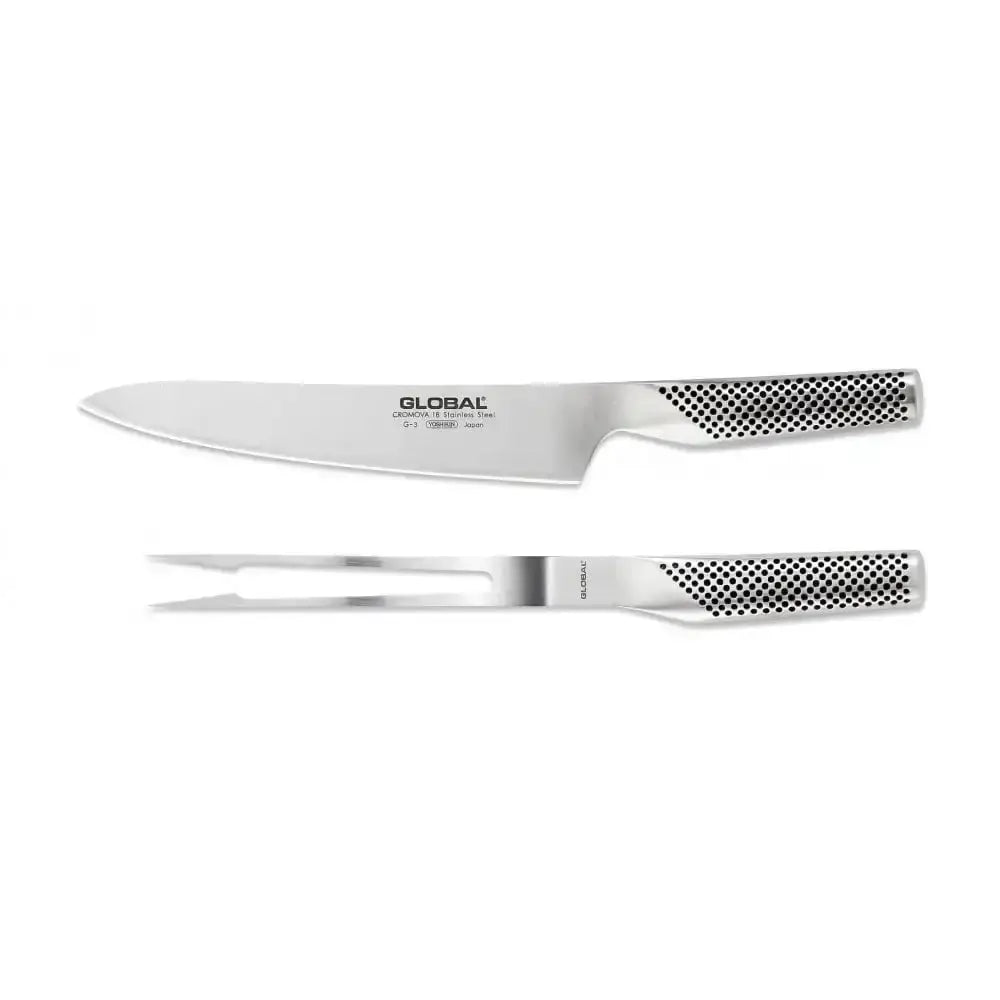 Set of Global chef's knife and carving fork on a white background