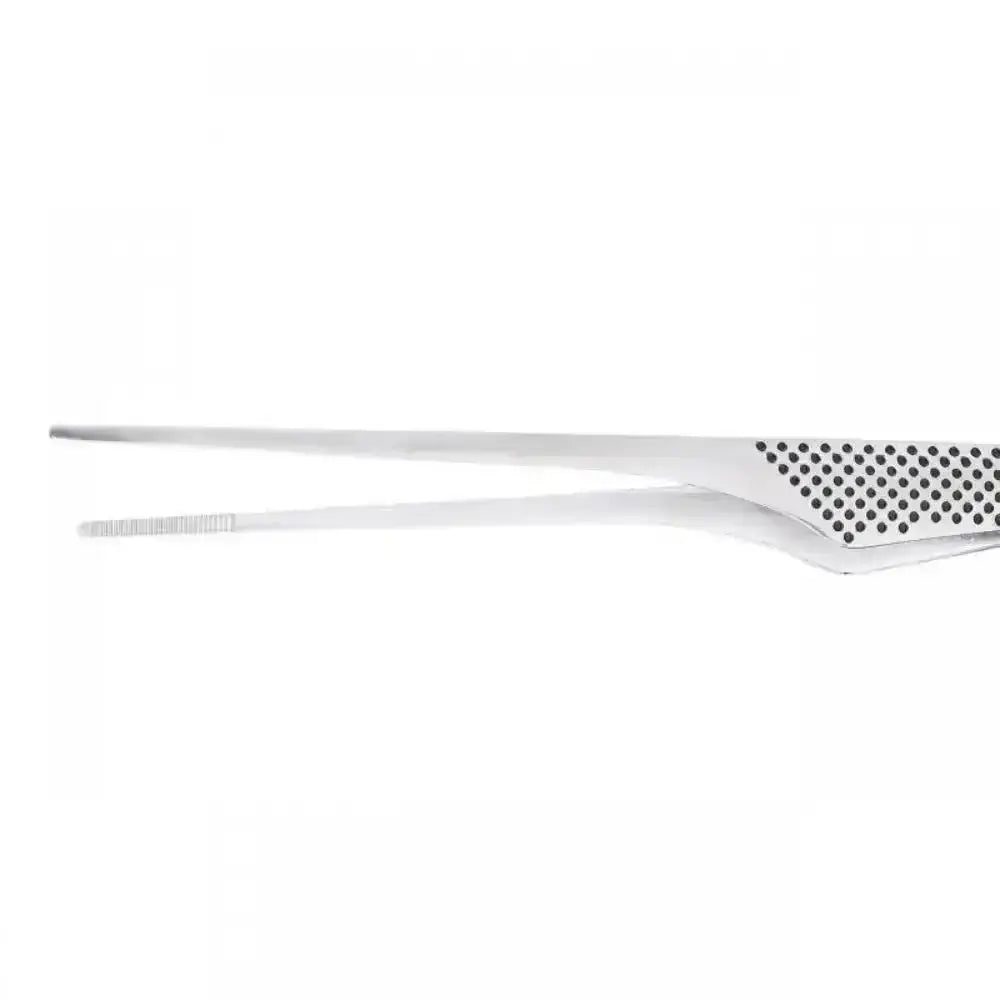 Close up of tweezers with perforated design on a white background