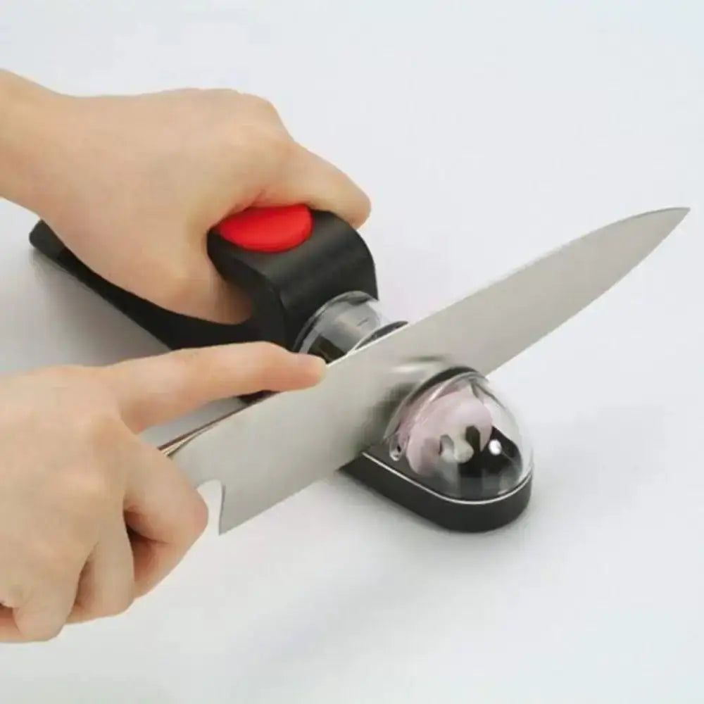 Person using a knife sharpener on a white background