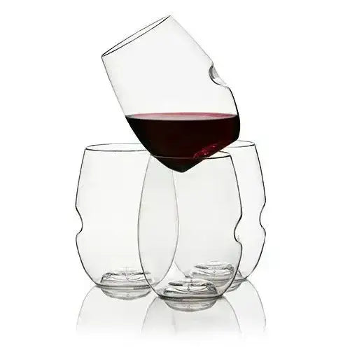 Two wine glasses with one tilted to show red wine on a white background