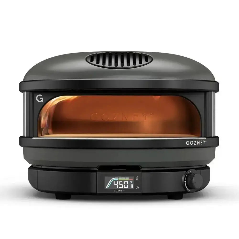 Gozney Arc 14 inch compact outdoor pizza oven in black with digital display at 450 degrees and glowing interior