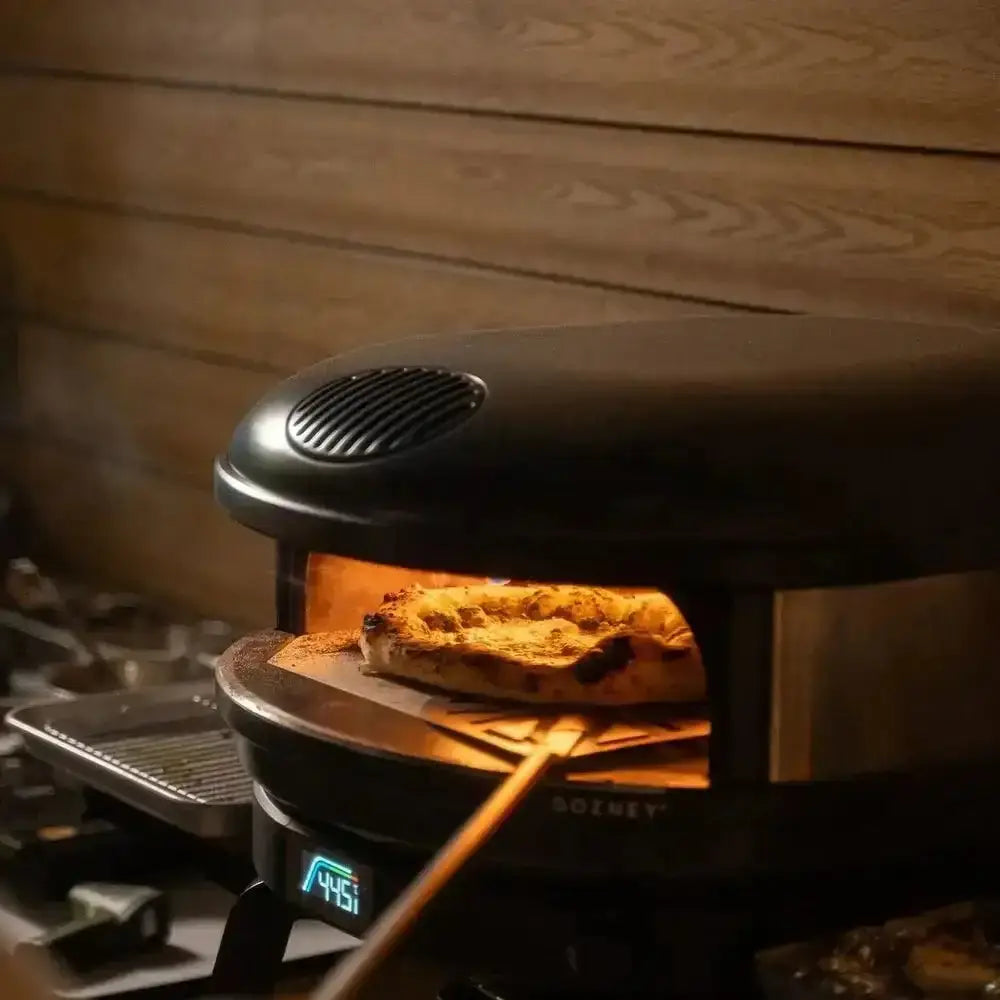 Gozney Arc XL 16 compact outdoor pizza oven baking pizza, modern kitchenware at Cookin Stores