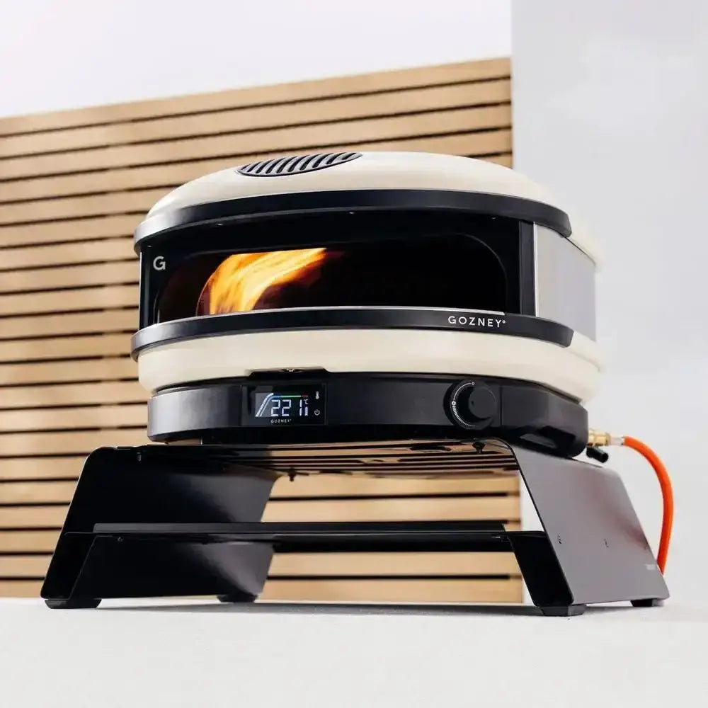Gozney Arc outdoor pizza oven with digital display on booster stand, showcased at Cookin Stores kitchenware shop.