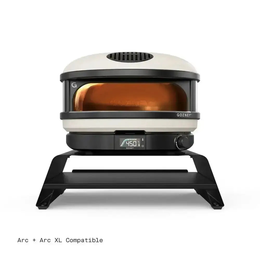 Gozney Arc and Arc XL countertop pizza oven on black booster stand, kitchenware at Cookin Stores