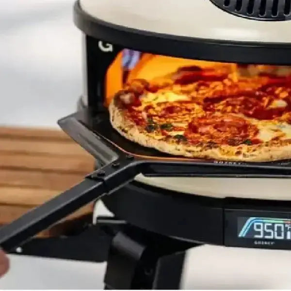 Gozney Balance Placement Peel holding pizza in outdoor pizza oven, premium kitchenware at Cookin Stores