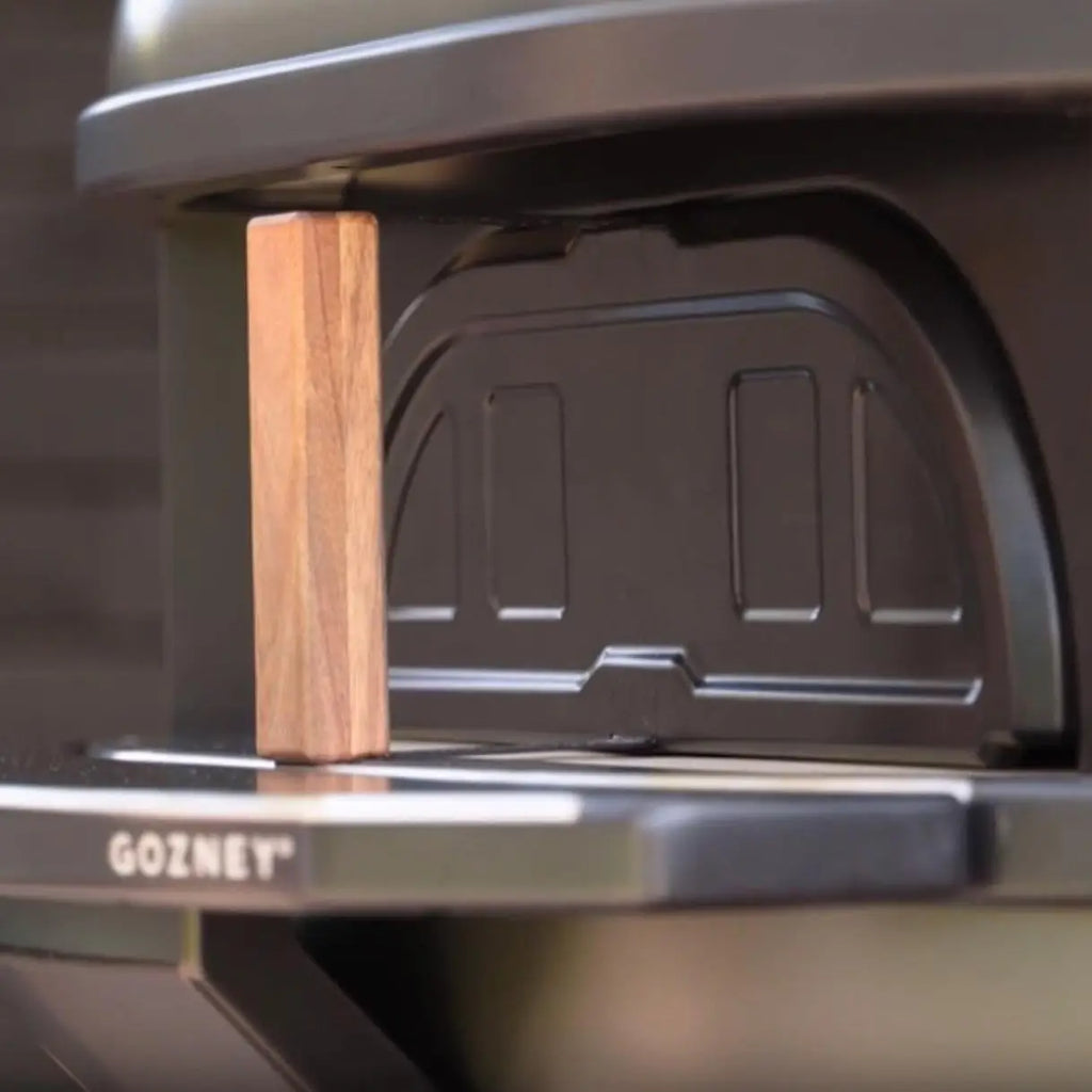 pizza oven bityh a door and wooden handle