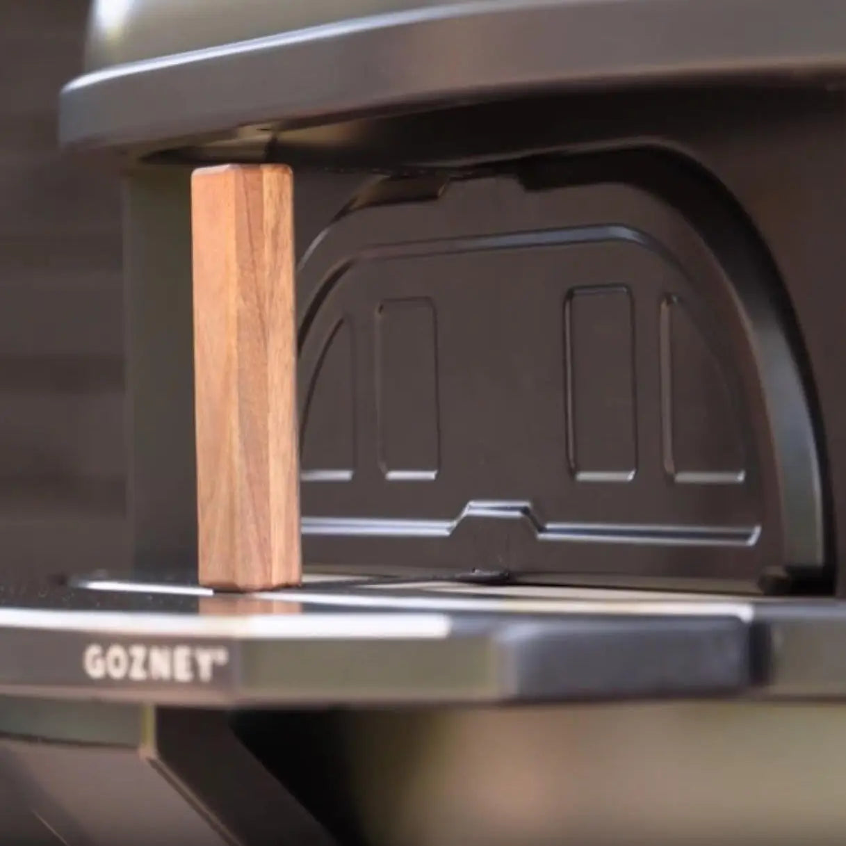 pizza oven bityh a door and wooden handle