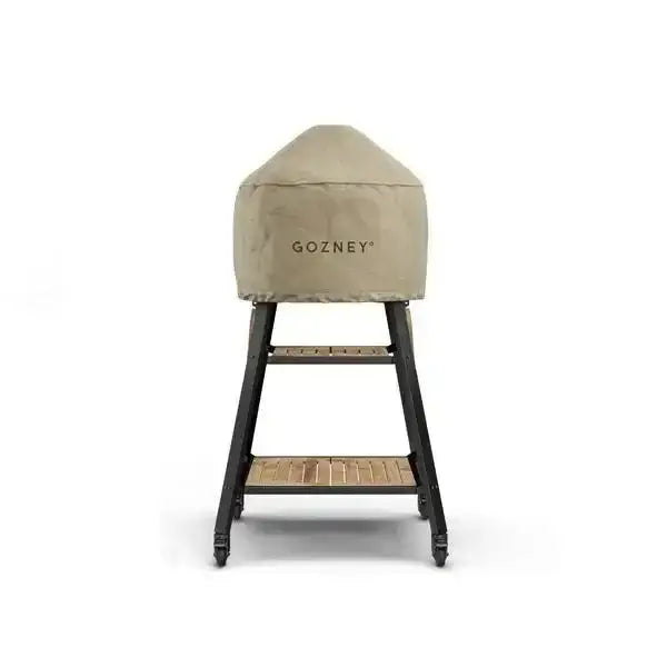 Gozney Dome outdoor pizza oven with fitted cover on wooden and metal stand, Cookin Stores