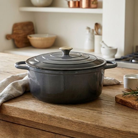 Gray enameled cast iron Dutch oven with lid on a white background
