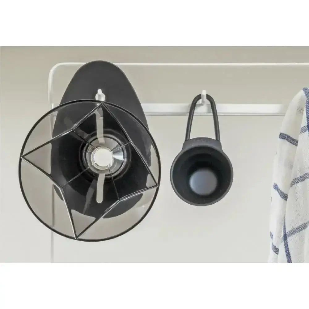 dripper filter e on a white wall